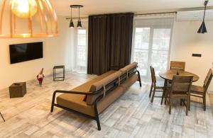TV a/nebo společenská místnost v ubytování Elite Loft Apart