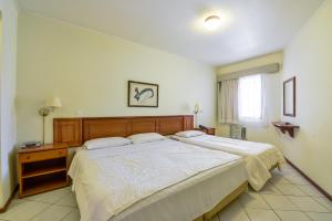 Katil atau katil-katil dalam bilik di Capital O Park Tower, Campinas
