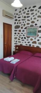 Posteľ alebo postele v izbe v ubytovaní Porto Lesvos hotel