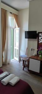 Posteľ alebo postele v izbe v ubytovaní Porto Lesvos hotel