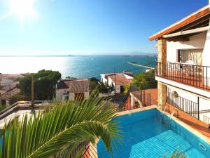 a view of the ocean from a house with a swimming pool at Holiday Home Joan Sarda by Interhome in Roses