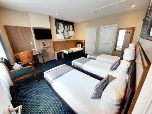 Postel nebo postele na pokoji v ubytování Hotel Washington