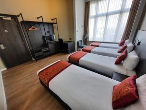 Postel nebo postele na pokoji v ubytování Hotel Washington