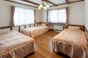 Giường trong phòng chung tại Pension Eastmountain Hakuba - Vacation STAY 95915