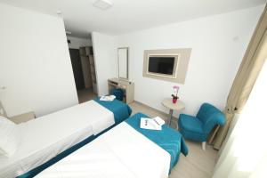 Postel nebo postele na pokoji v ubytování Hotel Delfin