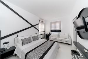 Ένα ή περισσότερα κρεβάτια σε δωμάτιο στο Divelia Hotel