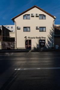 a building on the side of a street at Bada Bing Residence in Braşov