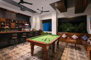a billiard room with a pool table and a bar at PATIO Hotel & Urban Resort in Phnom Penh