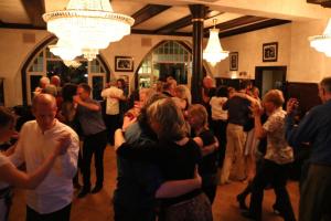 a group of people dancing in a room at Fachwerk-Kultur-Pension TangoBrücke in Einbeck