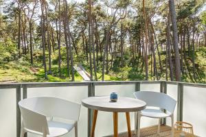 Ein Balkon oder eine Terrasse in der Unterkunft Upstalsboom Residenzen Trassenheide