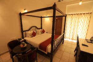 Voodi või voodid majutusasutuse Rangmahal Pushkar by DIV HOSPITALITY toas