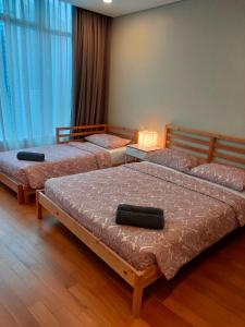 Tempat tidur dalam kamar di Vortex Suites KLCC by Sayang