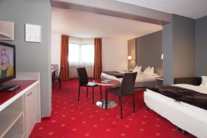TV a/nebo společenská místnost v ubytování Hotel Bruno