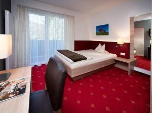 Postel nebo postele na pokoji v ubytování Hotel Bruno