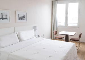 Cama ou camas em um quarto em Plaza São Rafael Hotel