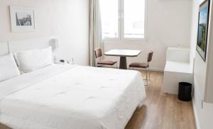 Cama ou camas em um quarto em Plaza São Rafael Hotel