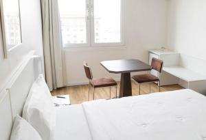 Cama ou camas em um quarto em Plaza São Rafael Hotel