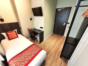 Postel nebo postele na pokoji v ubytování Hotel Washington