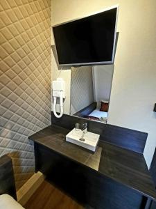 TV a/nebo společenská místnost v ubytování Hotel Washington