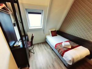 Postel nebo postele na pokoji v ubytování Hotel Washington