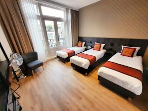 Postel nebo postele na pokoji v ubytování Hotel Washington