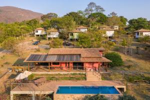 an aerial view of a house with a swimming pool at Villa Severina in Brumadinho