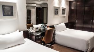 Cama ou camas em um quarto em Plaza São Rafael Hotel