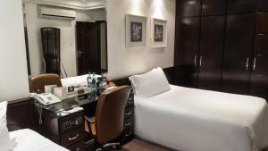 Cama ou camas em um quarto em Plaza São Rafael Hotel