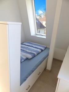 Postel nebo postele na pokoji v ubytování südausgerichtetes Apartment SüdWest Kleinmachnow