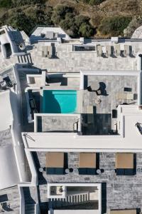 an aerial view of a house with a swimming pool at Homeric Poems in Fira
