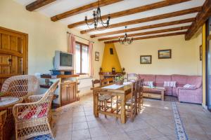 a living room with a couch and a table at Comfortable House in Carcabuey with Private Pool in Carcabuey