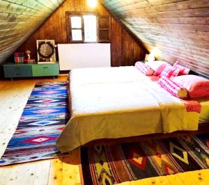 a bedroom with a large bed in a attic at Elegant villa with jacuzzi near Možđenec in Možđenec +59 photos
