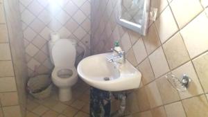a bathroom with a sink and a toilet at Spacious House in Hassilabied in Hassilabied +17 photos