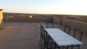 a blue table and chairs on top of a building at Spacious House in Hassilabied in Hassilabied