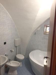 a white bathroom with a sink and a toilet at Modern Apartment in Gallipoli with Air Conditioning in Gallipoli
