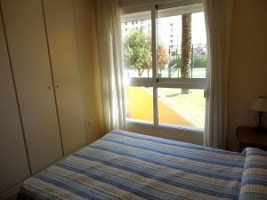 Posteľ alebo postele v izbe v ubytovaní Charming Apartment in Dénia with Shared Pool