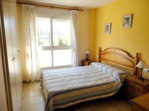 Posteľ alebo postele v izbe v ubytovaní Charming Apartment in Dénia with Shared Pool