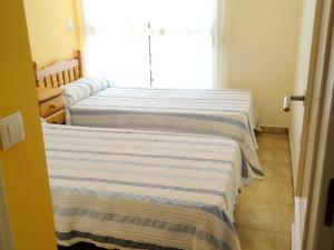 Posteľ alebo postele v izbe v ubytovaní Charming Apartment in Dénia with Shared Pool
