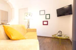a living room with a couch and a table at One bedroom appartement with city view balcony and wifi at Marsala 5 km away from the beach in Marsala