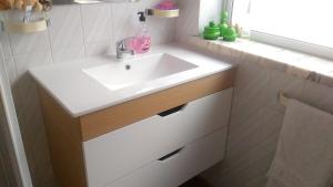 a bathroom with a white sink and a mirror at Charming house with mountain view in Manteigas, fireplace in Manteigas +21 photos