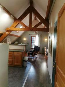 a kitchen with wooden ceilings and a dining room at Chalet de 3 chambres avec sauna et wifi a Arrens Marsous in Arrens-Marsous