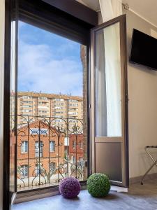 Televízia a/alebo spoločenská miestnosť v ubytovaní Comfortable apartment in León - 55 m² + Balcony
