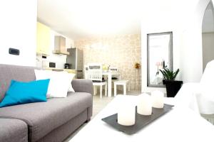 a living room with a couch and a table at Modern Apartment in Trogir - 70 m² - Parking Included in Trogir +11 photos