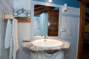 a bathroom with a sink and a mirror at Studio with balcony and wifi at Robledillo de Gata in Robledillo de Gata