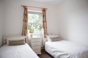 Voodi või voodid majutusasutuse Inviting 4-Bed House in Strokestown toas