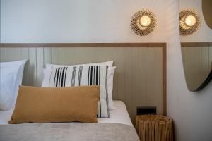 A bed or beds in a room at Anthos Villas - Chania