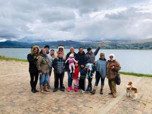 a group of people standing in front of a lake at Madervill Hospedaje in Aquitania +15 photos