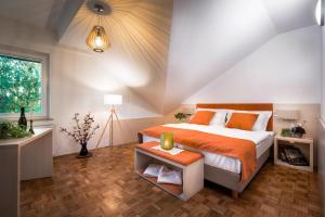 מיטה או מיטות בחדר ב-Hotel Gostilna Vovko