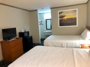 Postel nebo postele na pokoji v ubytování Days Inn by Wyndham Manning