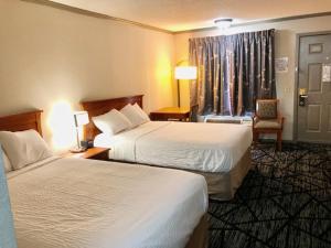 Postel nebo postele na pokoji v ubytování Days Inn by Wyndham Manning